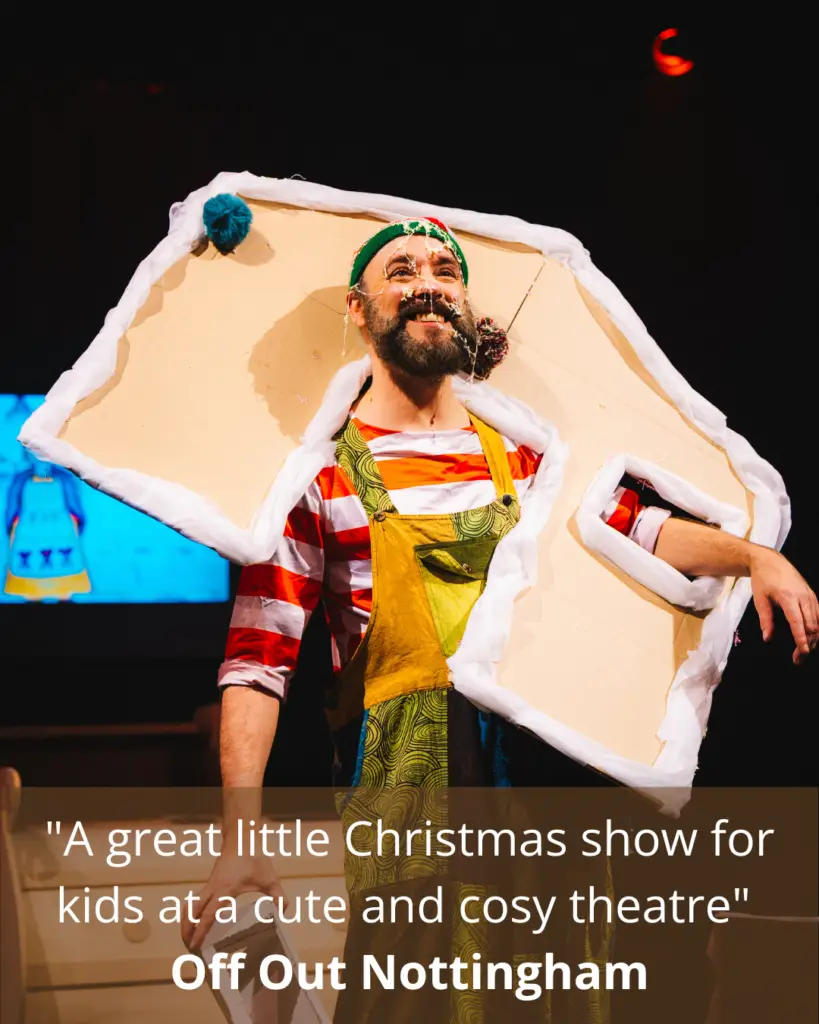 An actor appears trapped in the front of a gingerbread house during a performance of Merry Elwin: The Adventurous Elf