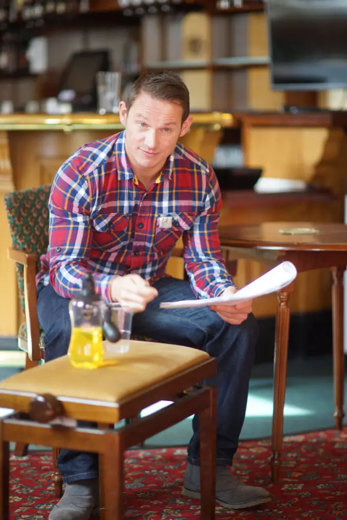 Paul Broesmith rehearsing for Paul's Ball with script in hand.